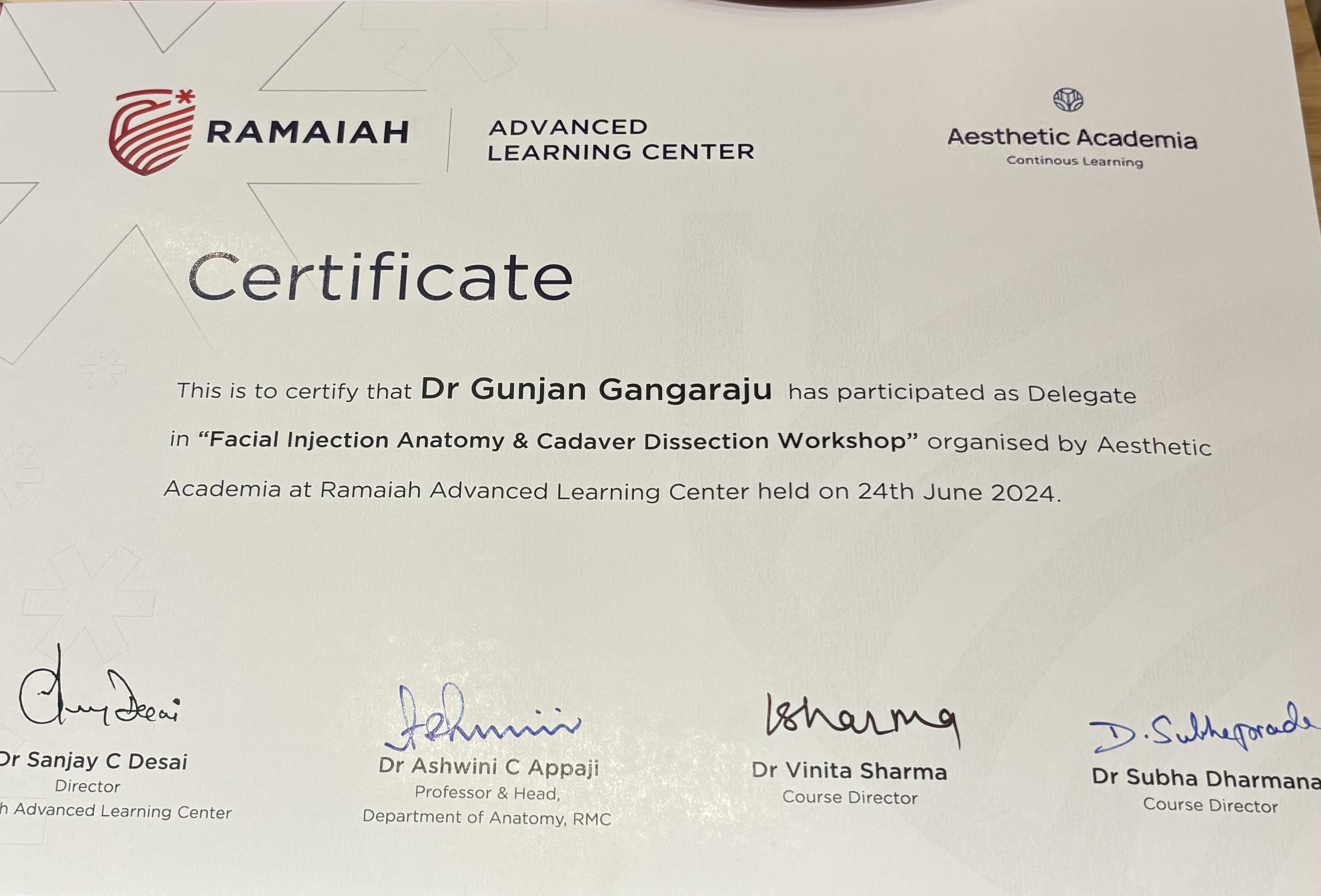presenting award to Dr. Gunjan Gangaraju